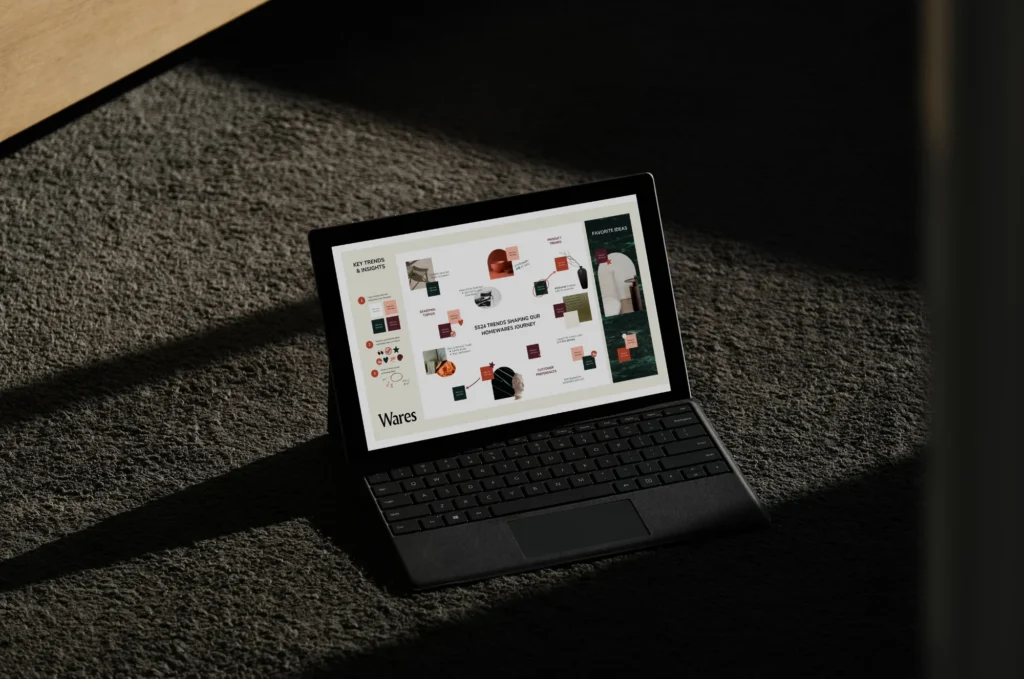 A tablet displaying a professional brand design layout with visual trends and infographics, showcasing KMP Digital Media's creative graphic design services for every brand